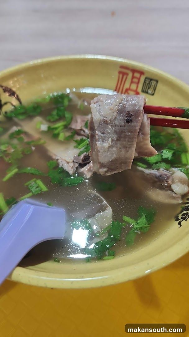 Bowl of Soup with Meat and Cilantro