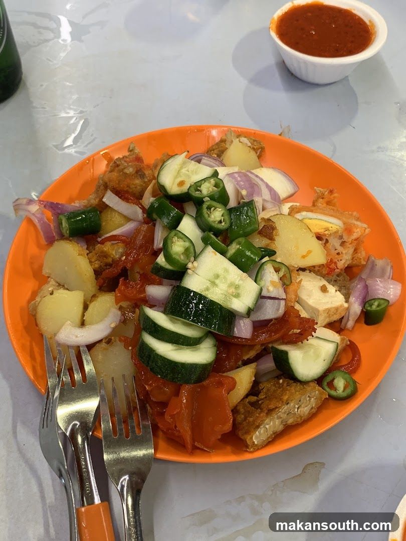 Plate of Fried Rice with Cucumber and Chili