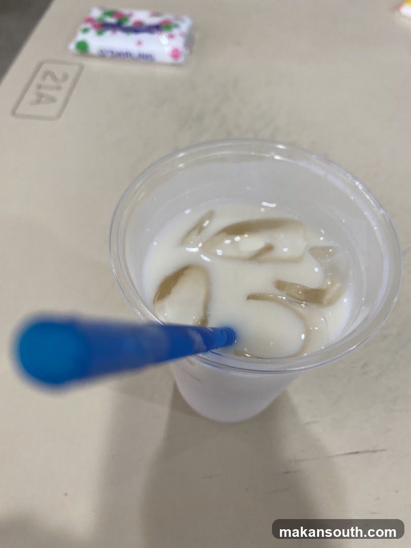 Beverage with milk and jelly in plastic cup