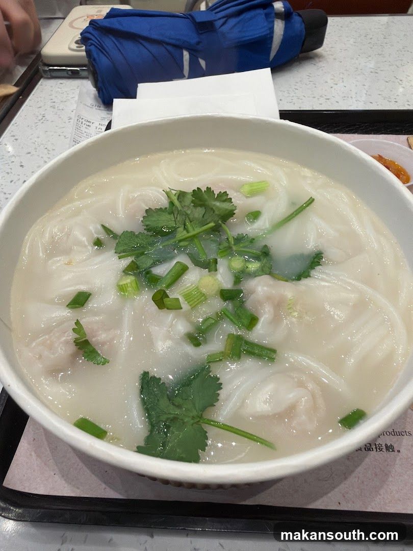 Bowl of Noodle Soup with Garnish