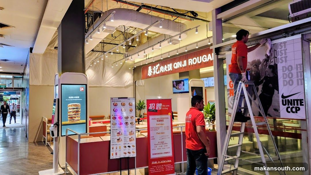 Food Court Interior with Staff Cleaning