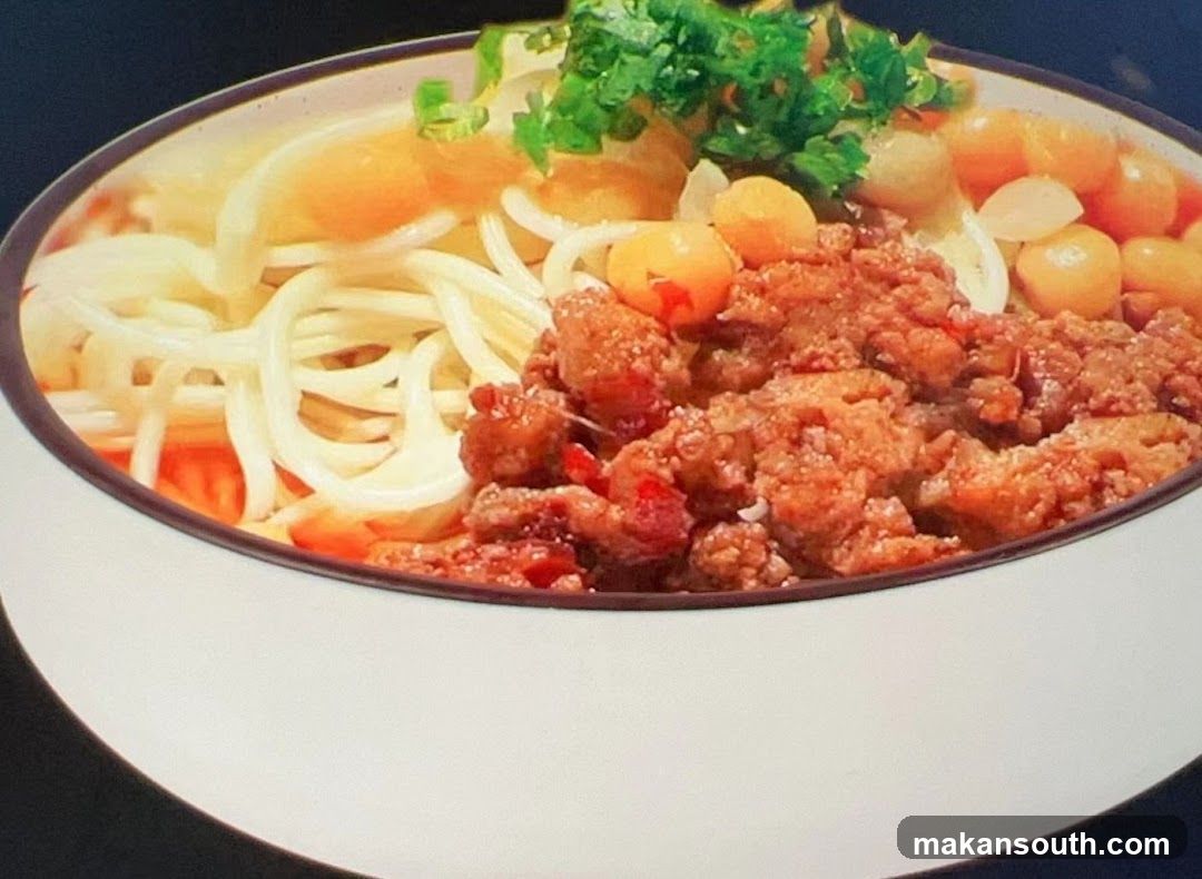 Bowl of Noodles with Meat Sauce and Vegetables