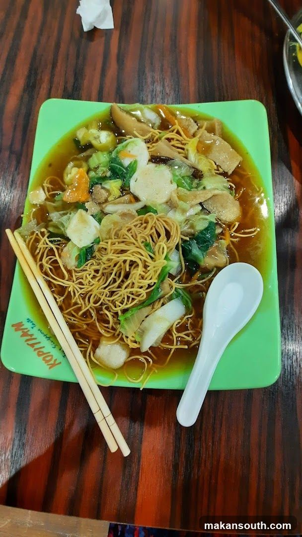 Noodle Dish with Chopsticks and Spoon
