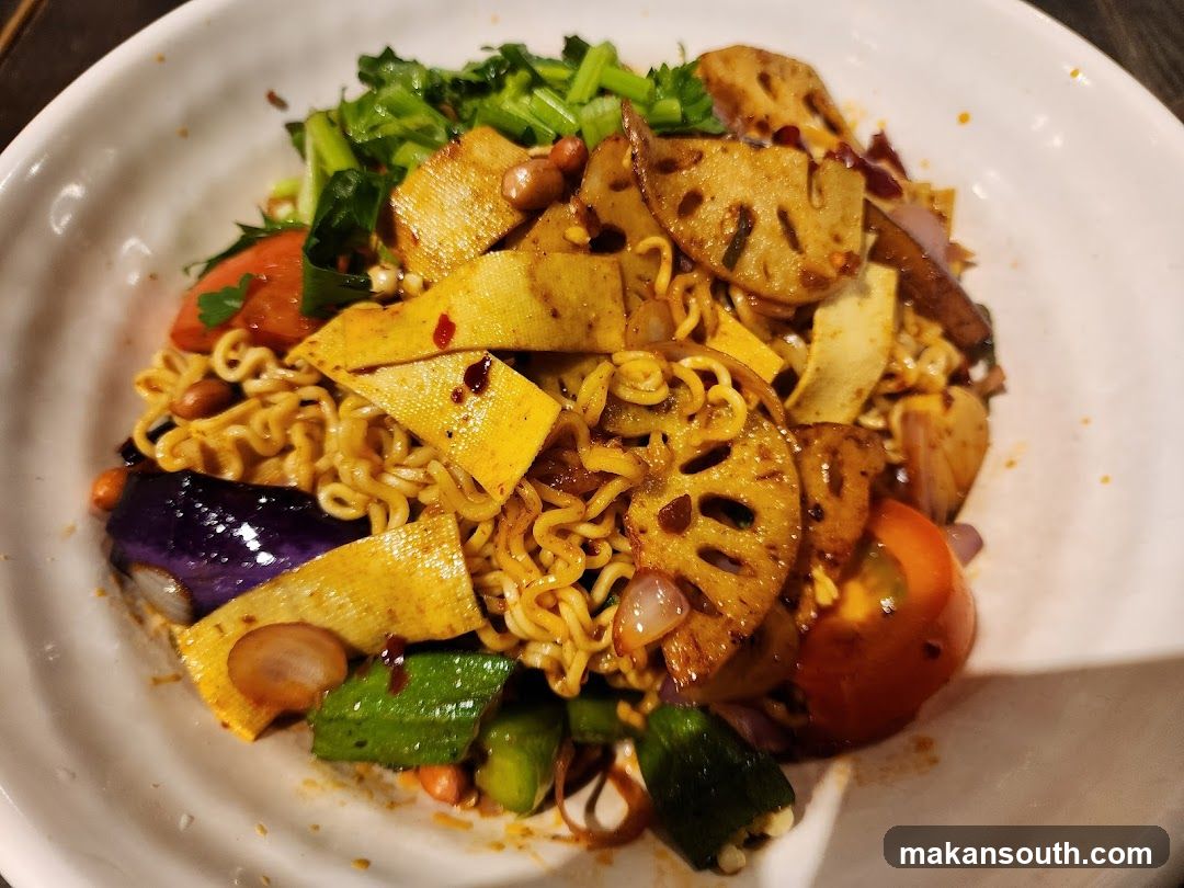 Spicy Noodle Bowl with Vegetables and Lotus Root