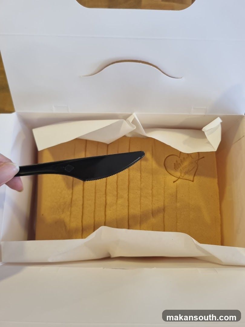 Cake in box with knife