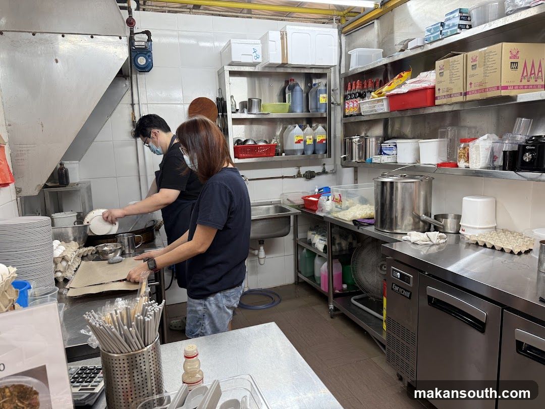 Kitchen Interior with Staff Preparing Food