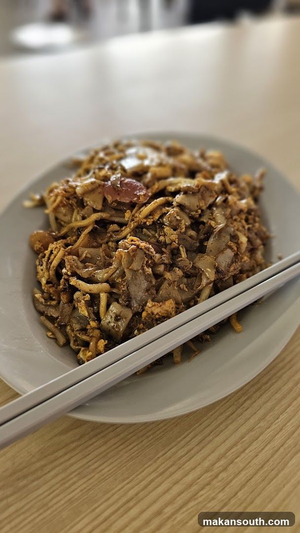 Plate of Fried Noodles with Chopsticks