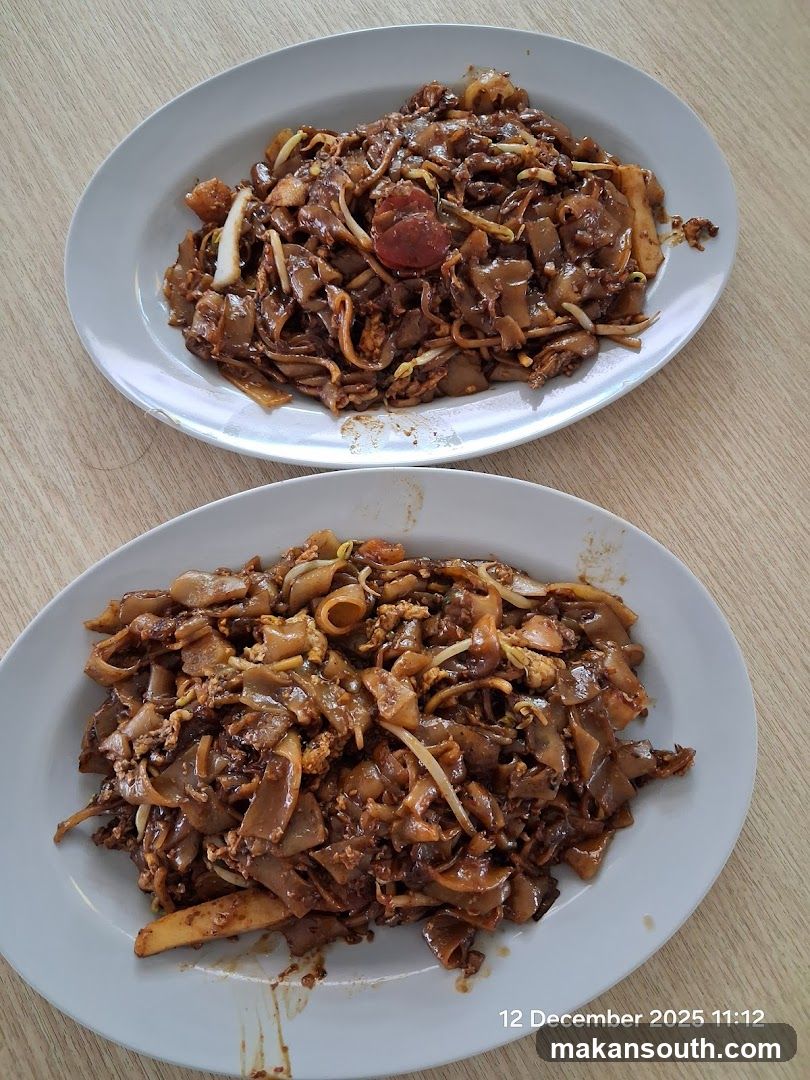 Two plates of stir-fried noodles