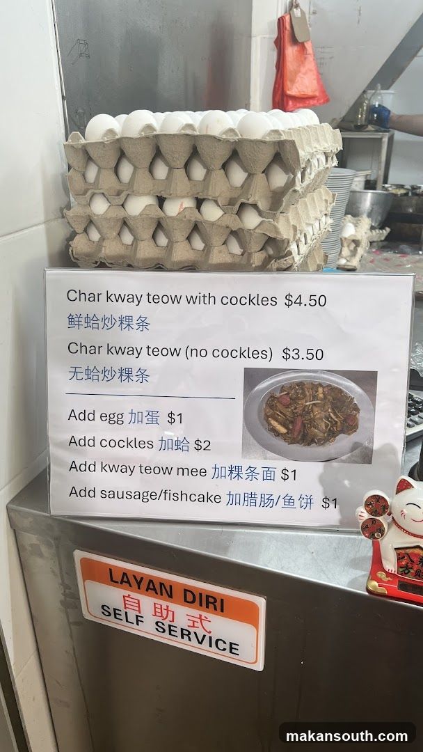 Food stall interior with egg cartons and menu board