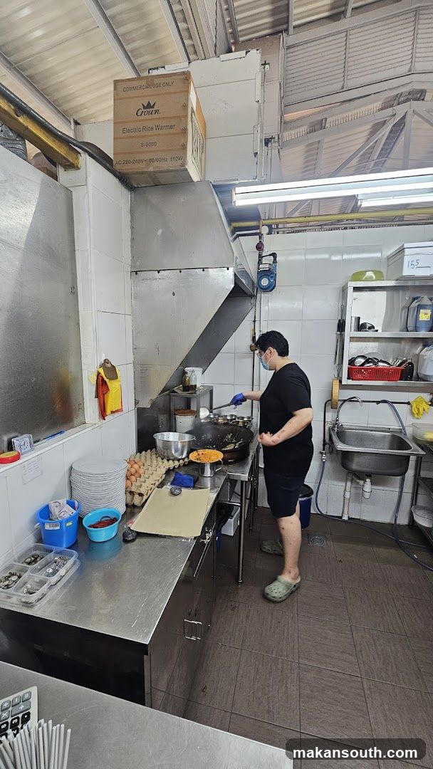 Kitchen Interior with Staff Cooking