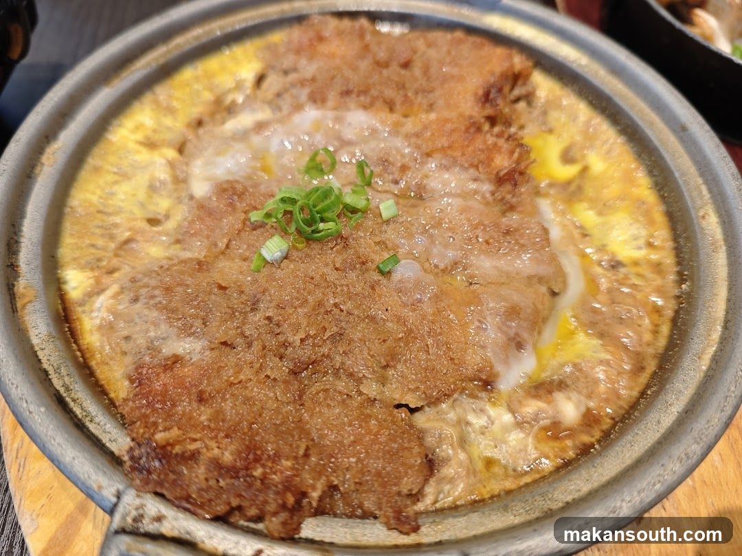 Sizzling Meat Dish in Clay Pot