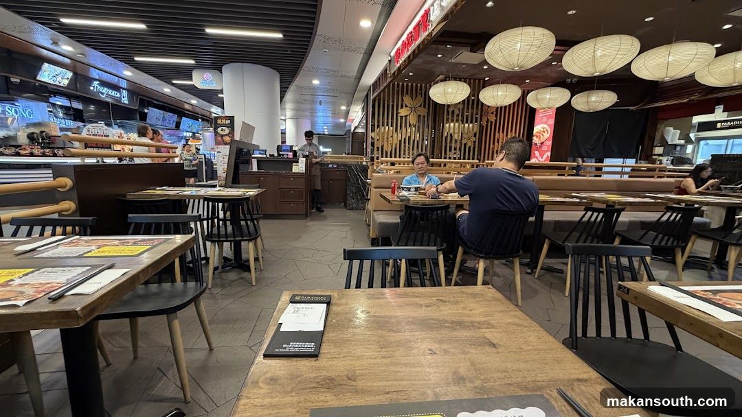 Restaurant Interior with Wooden Tables and Hanging Lamps
