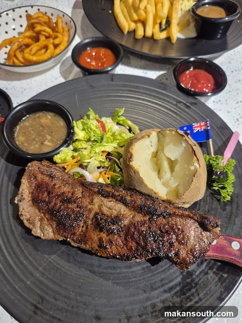 Steak Meal with Sides and Sauces