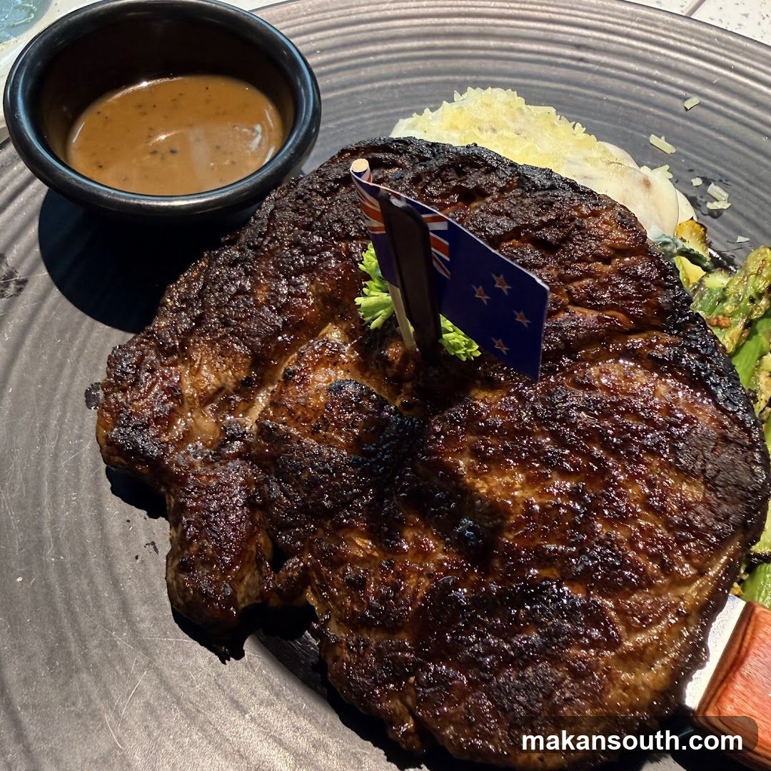 Grilled Steak with Sauce and Side Dish