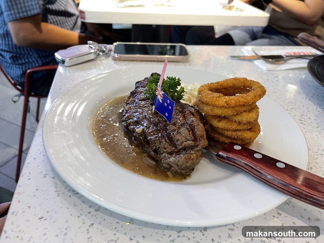 Steak with Onion Rings and Sauce
