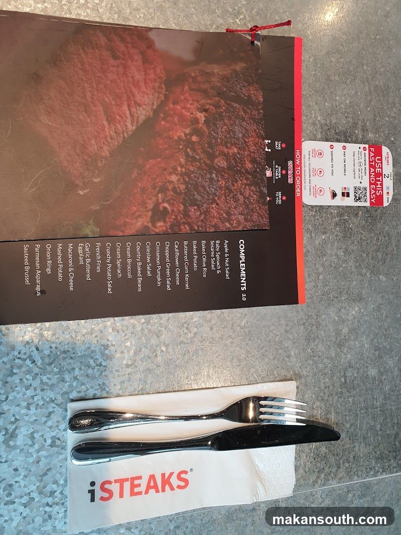 Steakhouse Table Setting with Menu and Cutlery