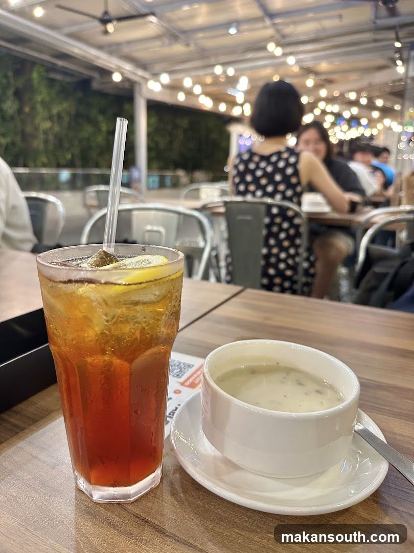 Outdoor Cafe Setting with Iced Tea and Soup
