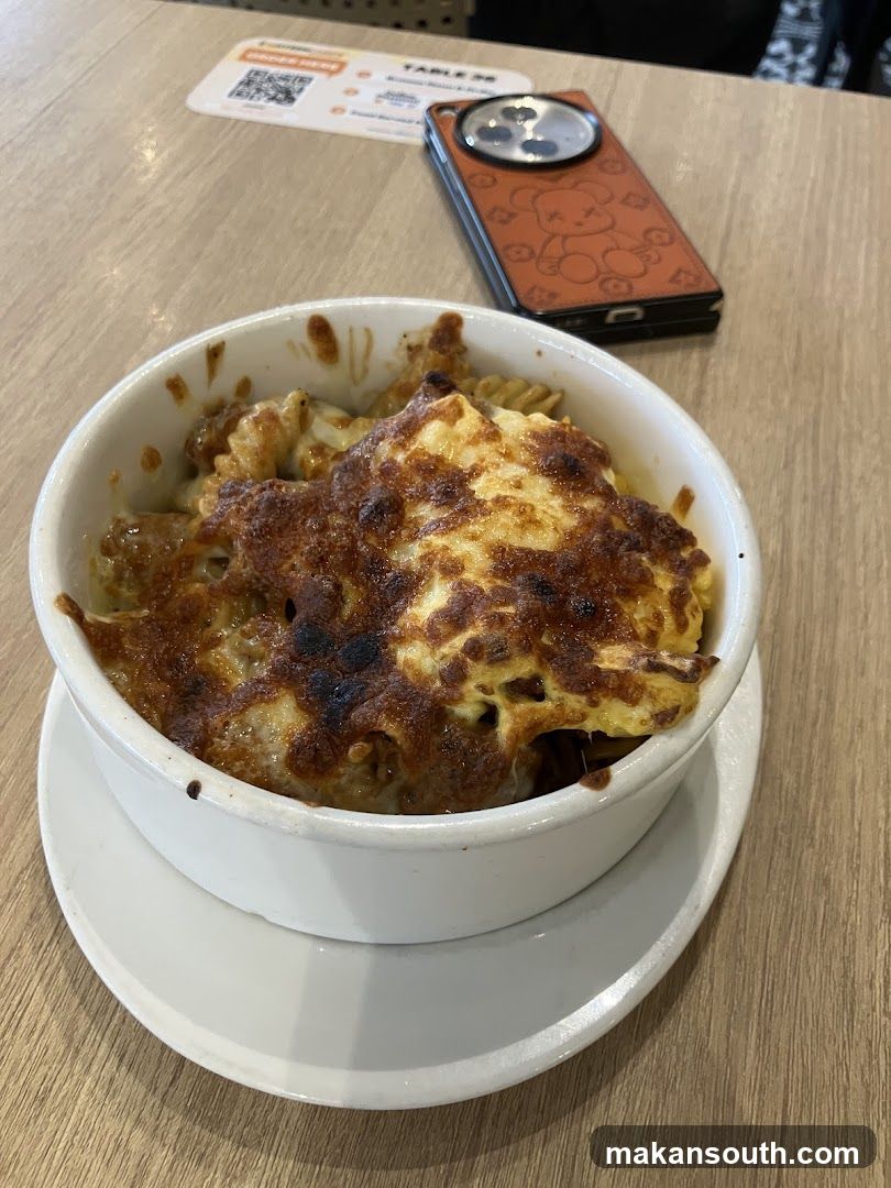 Baked Pasta Dish with Phone and Table Card