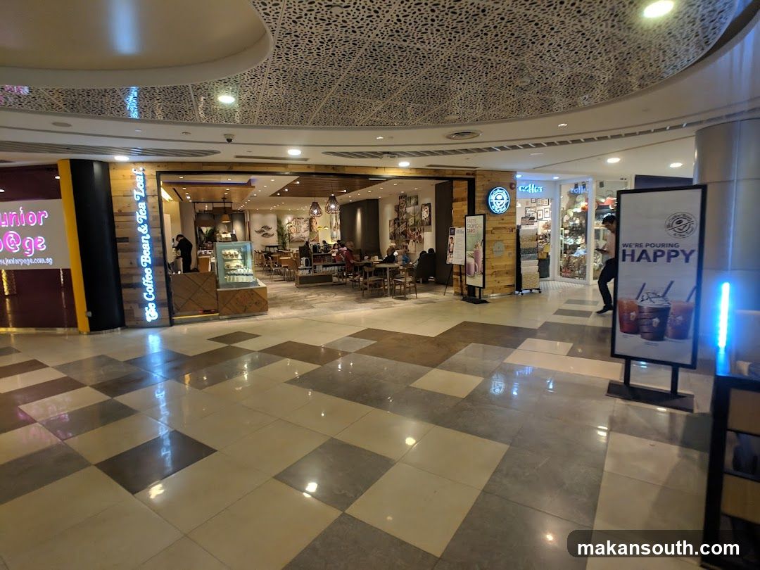 Mall Interior with Coffee Shop and Storefronts
