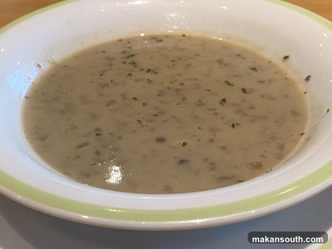 Bowl of creamy soup with herbs