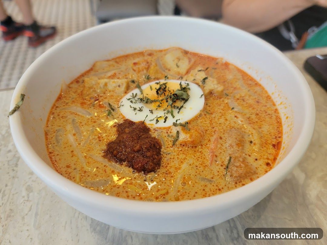 Bowl of Curry Noodles with Egg and Chili Paste