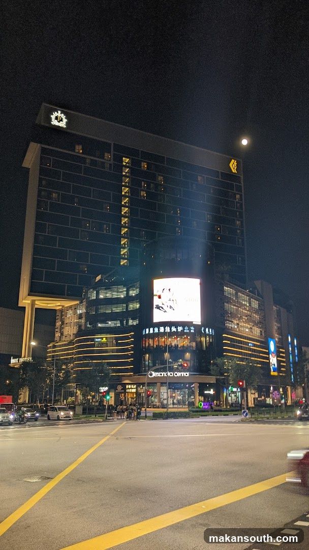 Night City Street View with Hotel and Commercial Buildings