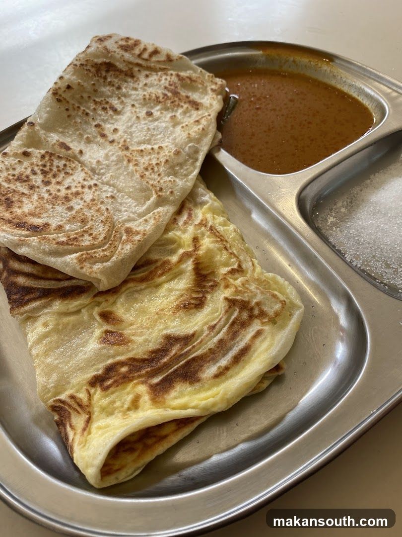 Food Plate with Roti Canai and Curry