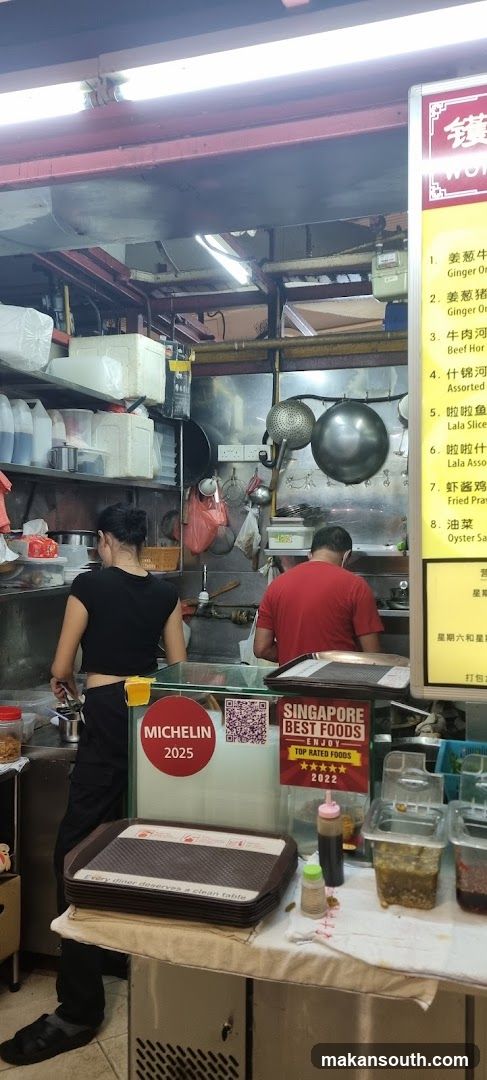 Food Stall Interior with Staff Cooking