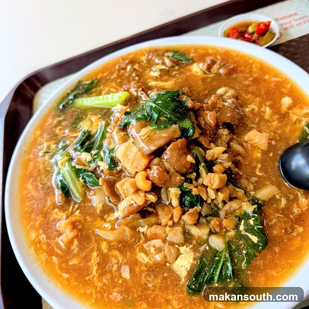 Bowl of Soup with Meat and Greens