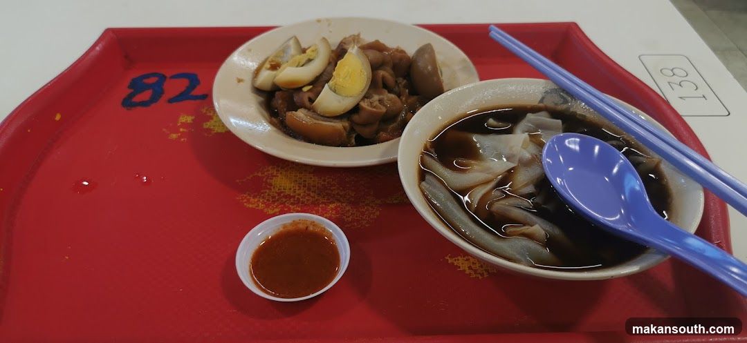 Cantonese-style food tray with rice noodles and braised pork
