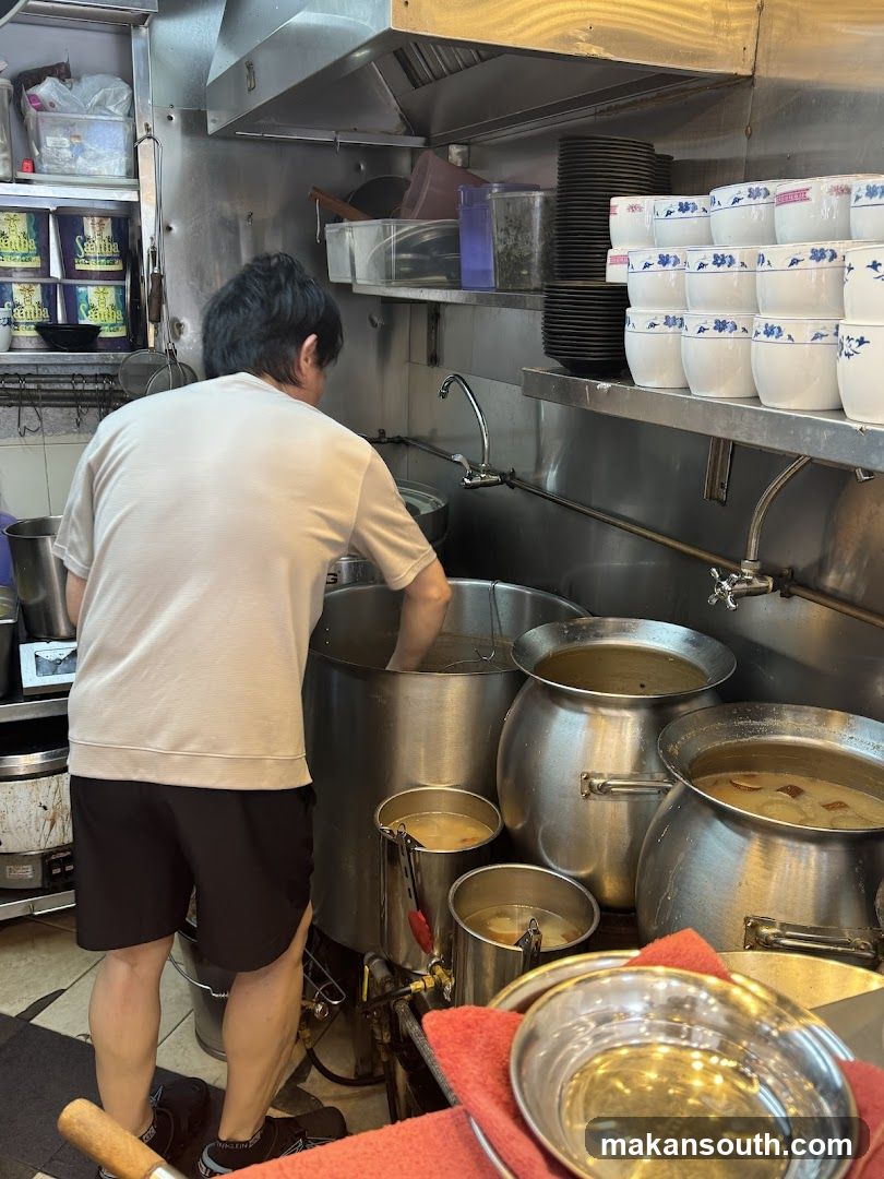 Kitchen Interior with Staff Preparing Food