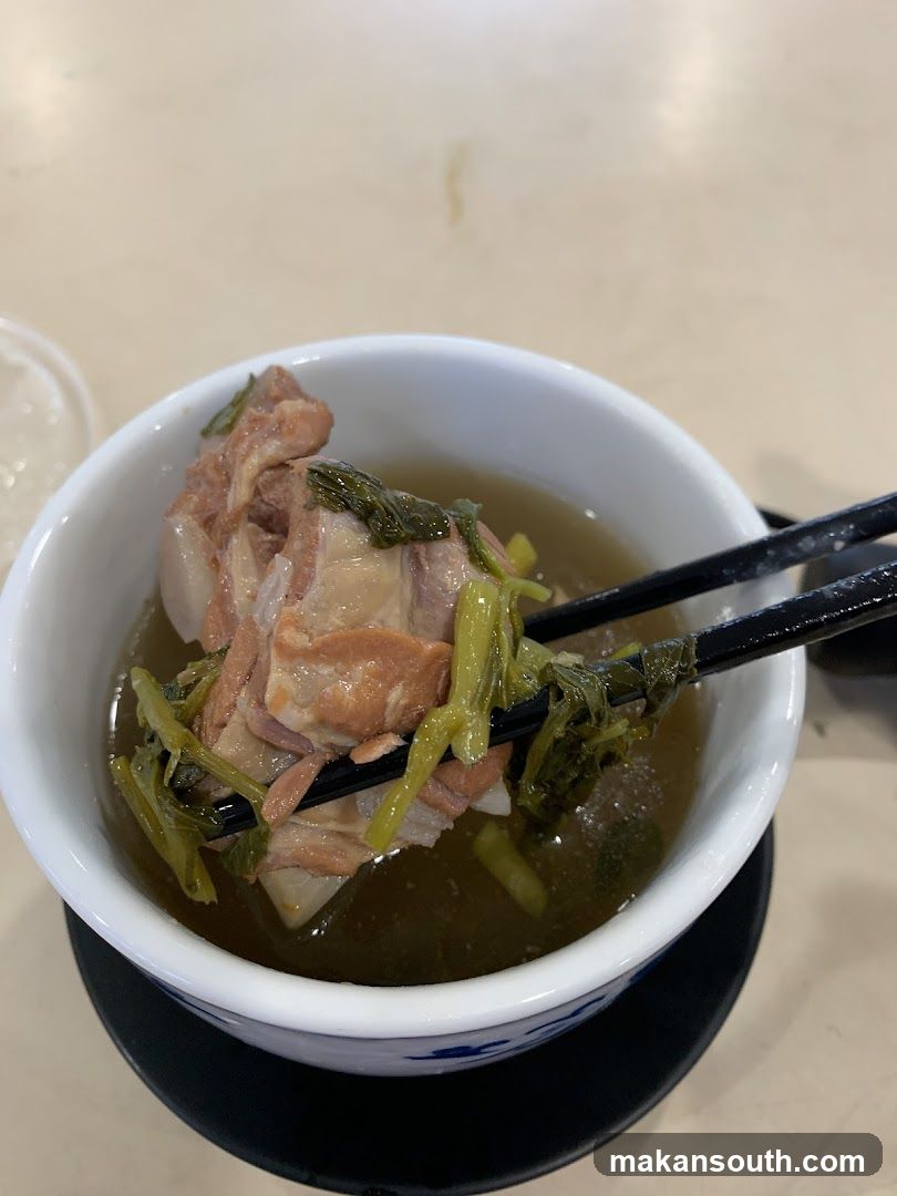 Bowl of Soup with Meat and Greens