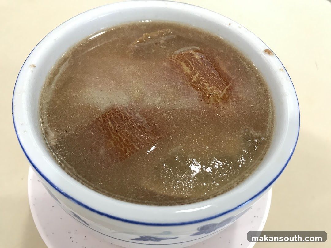 Bowl of Brown Soup with Meat