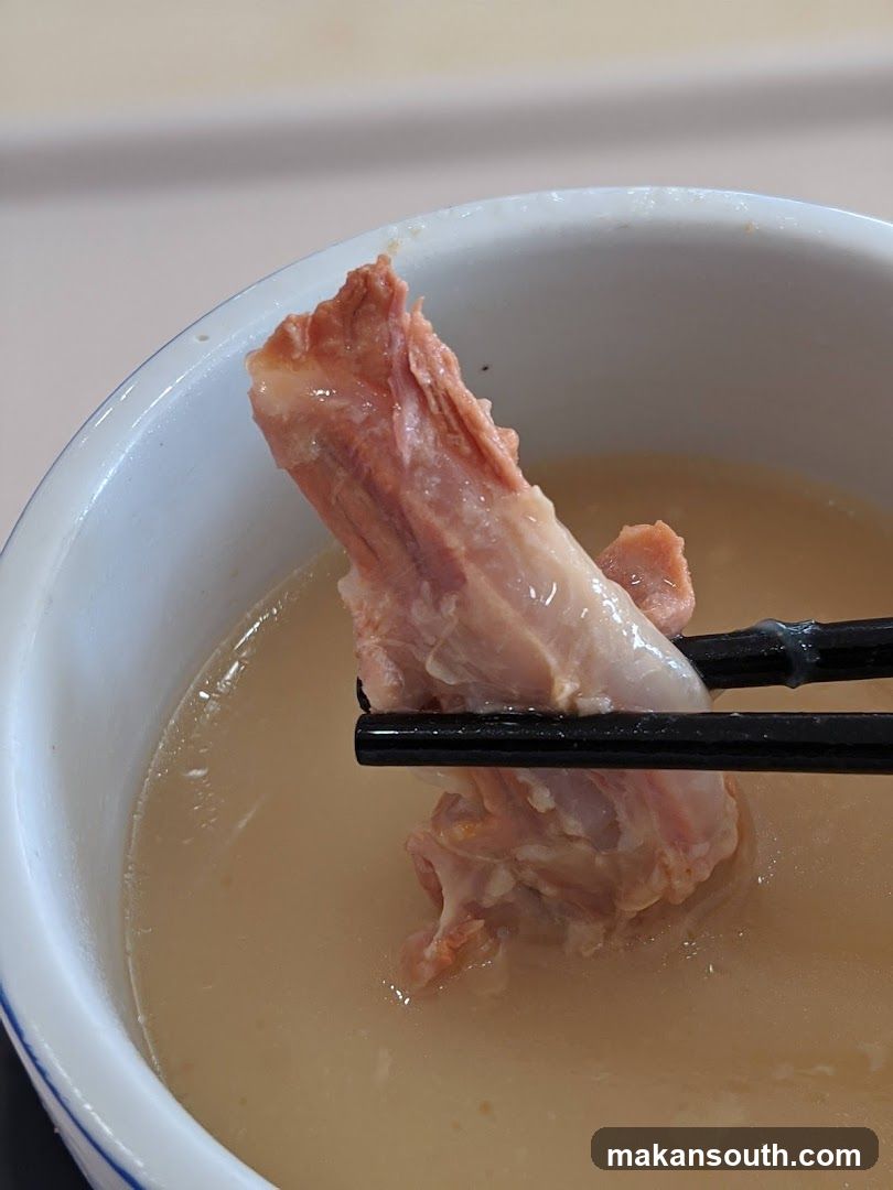 Bowl of Soup with Meat Bone