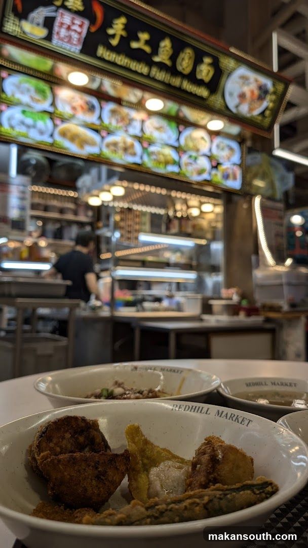 Food stall interior with bowls in foreground