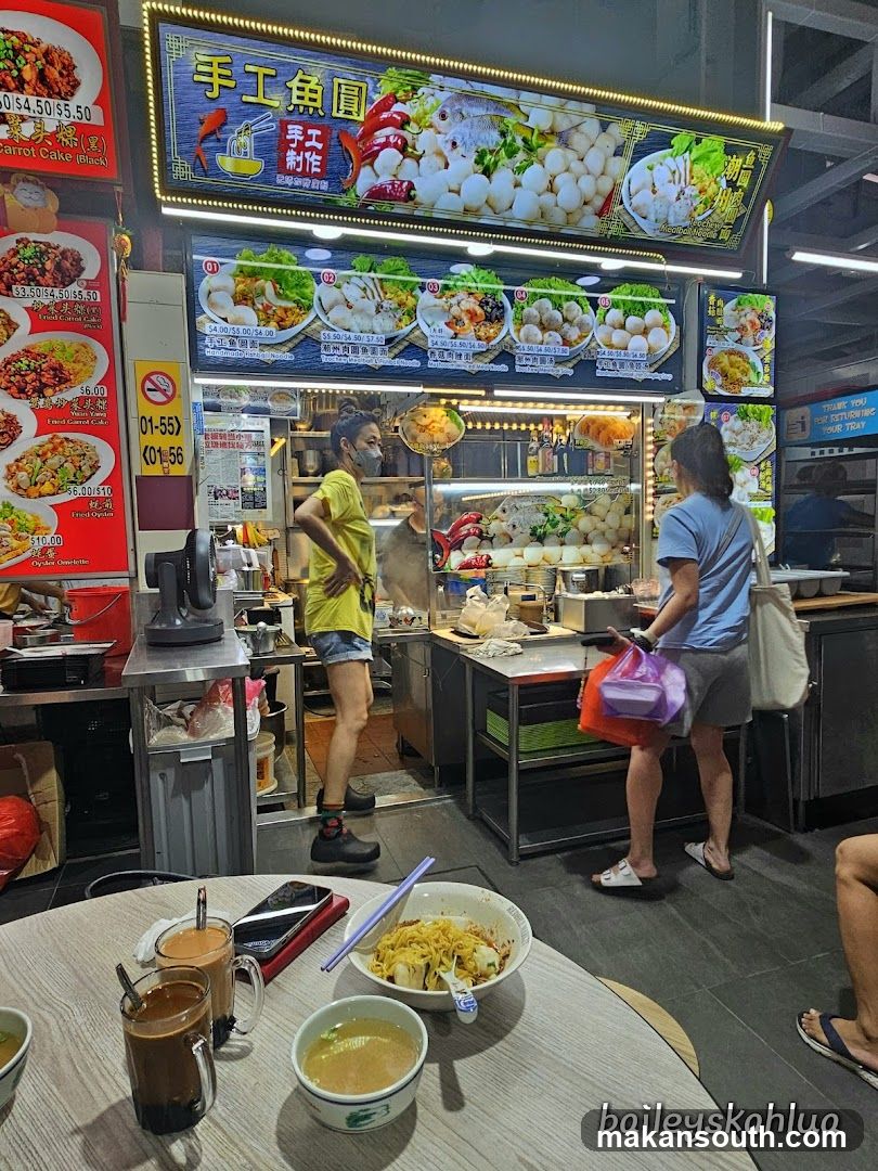 Food Stall Interior with Menu Board and Dining Area