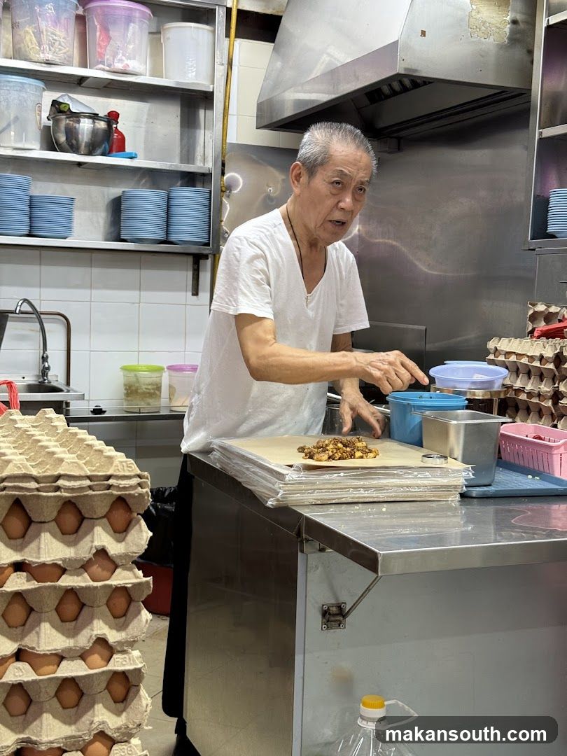 Kitchen Scene with Elderly Chef