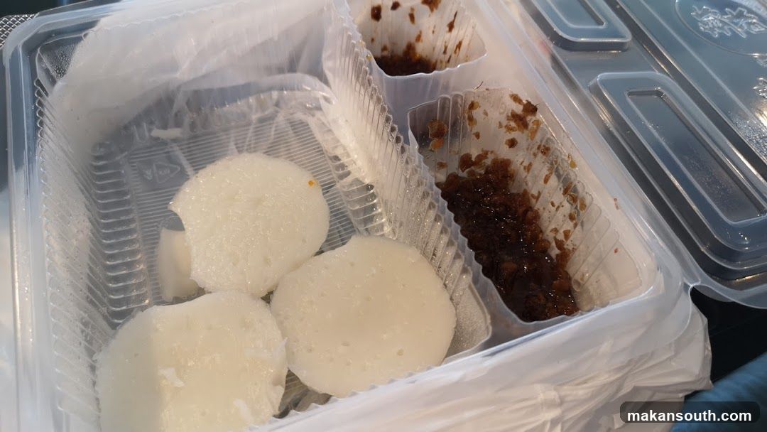 Takeout Food Container with Rice Cakes and Sauce