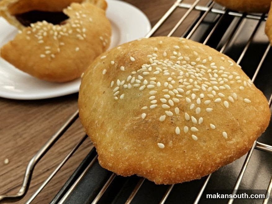 Sesame Seed Fried Pastries on Cooling Rack