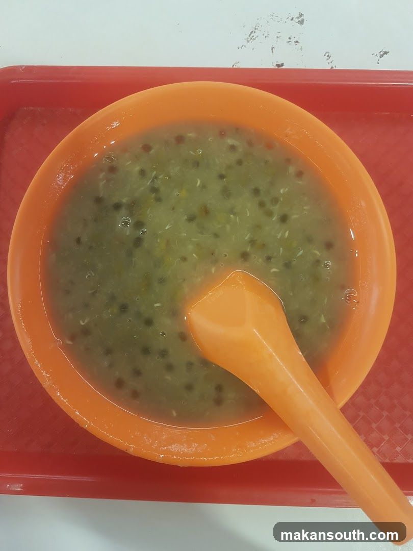 Bowl of Green Mung Bean Soup with Sesame Seeds