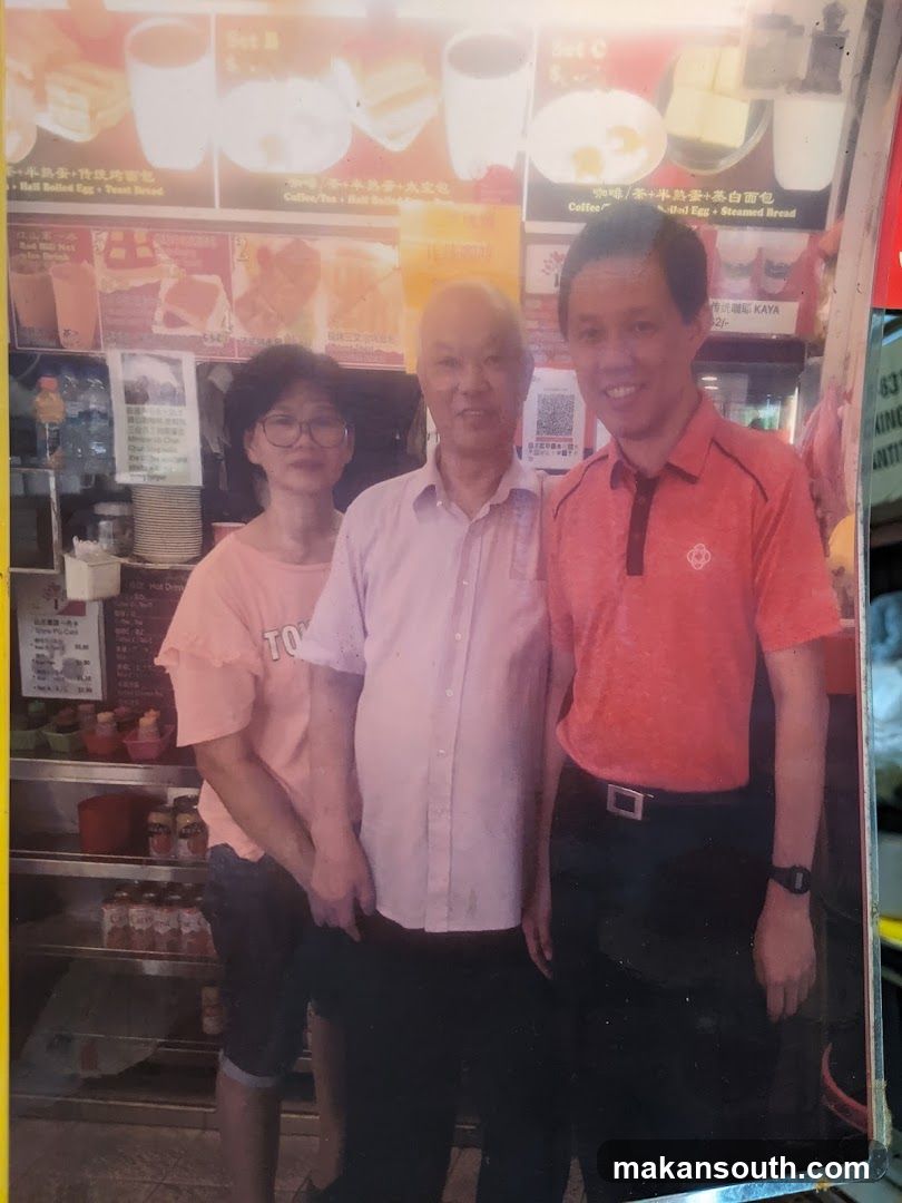 Group photo in front of a food stall