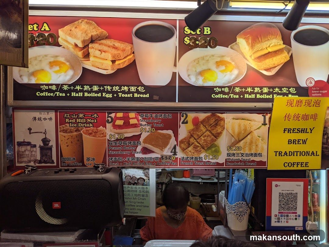 Food Stall Interior with Menu Board and Staff