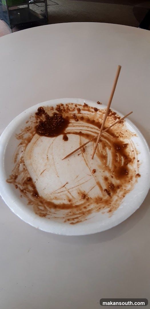 Empty Plate with Leftover Sauce and Chopsticks