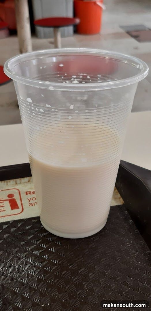 Milk in plastic cup at food stall