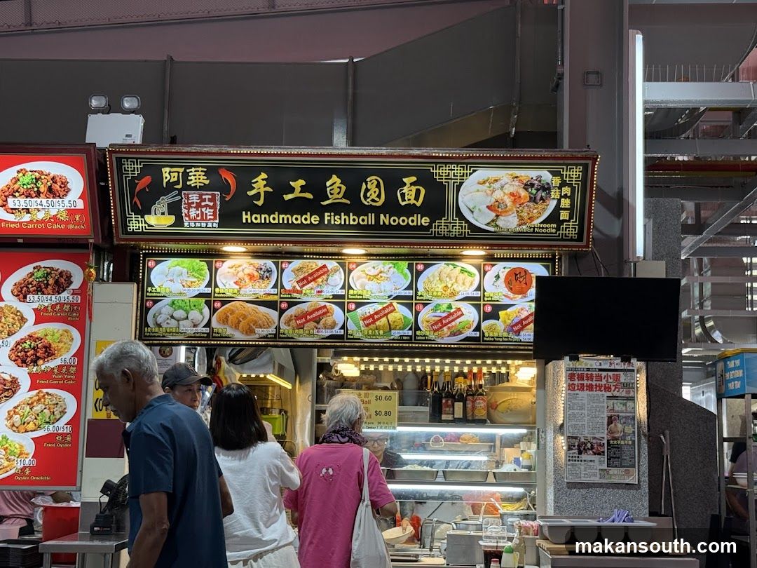 Food Stall Interior with Menu Board and Customers