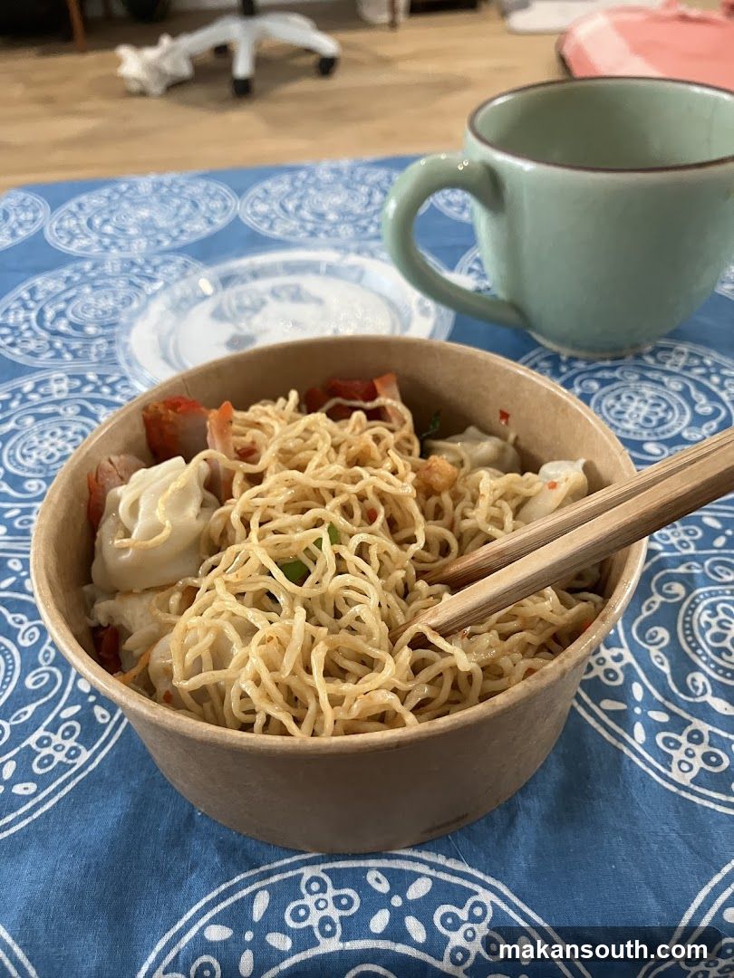 Noodles with dumplings and chopsticks