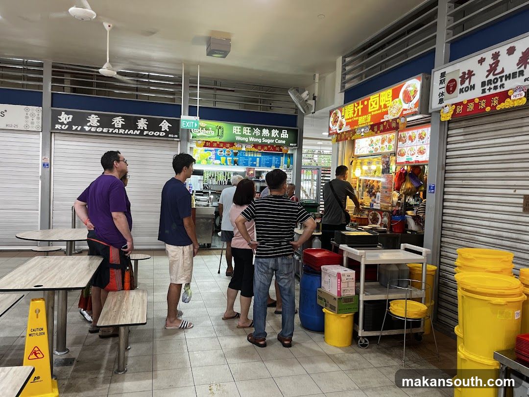 Food court interior with customers and stalls