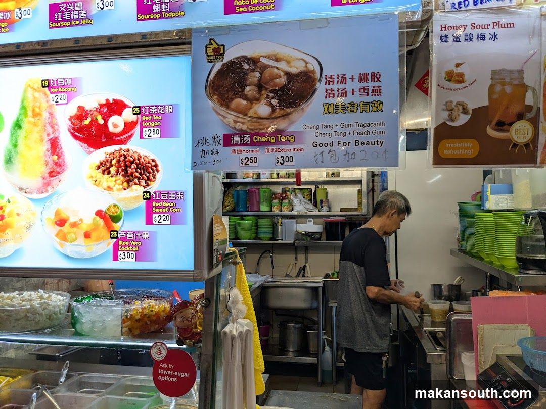 Food stall interior with staff preparing food
