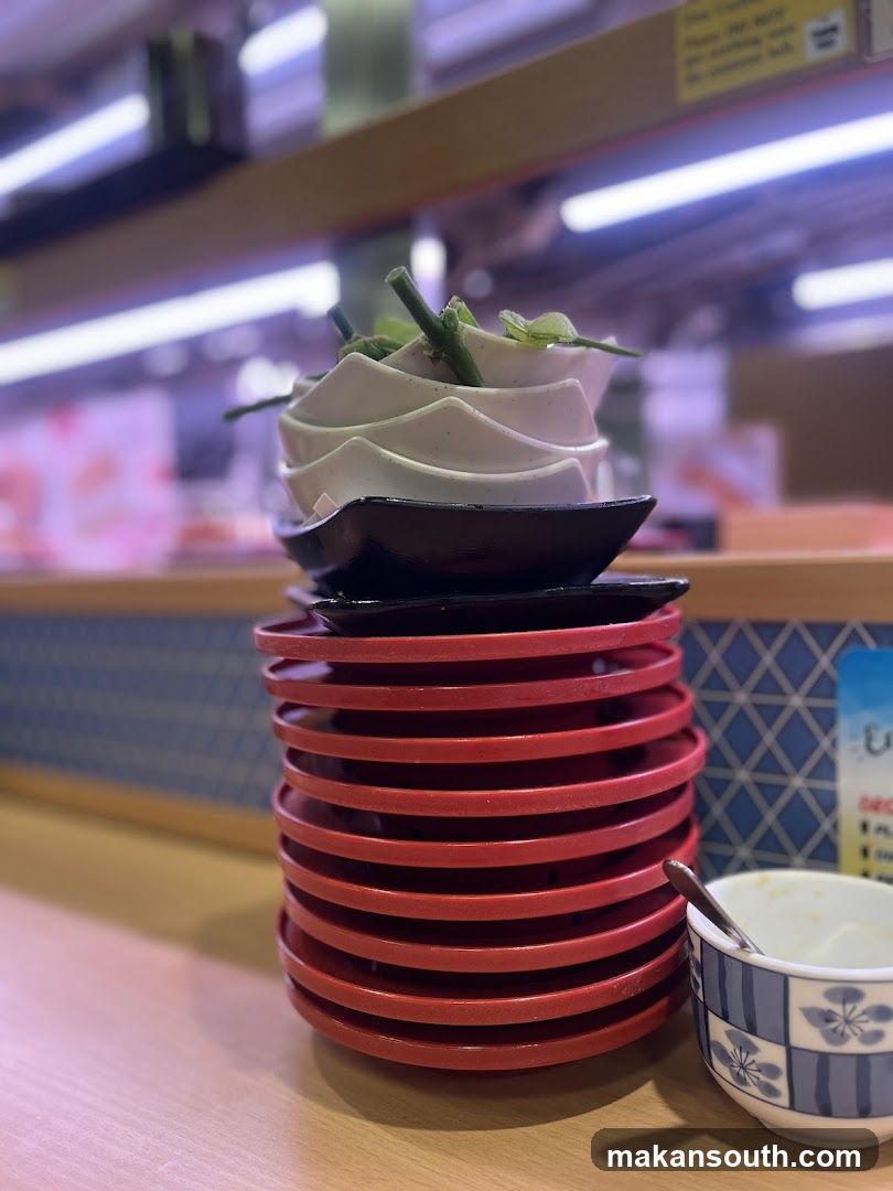 Stack of Red Plates with Dessert