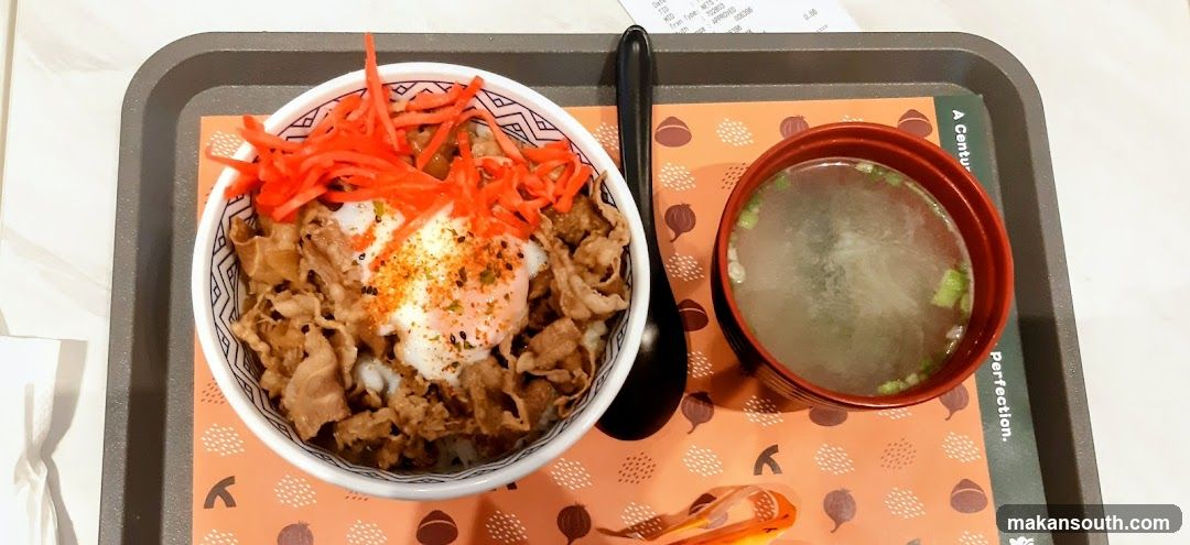Bowl of beef rice with egg and soup